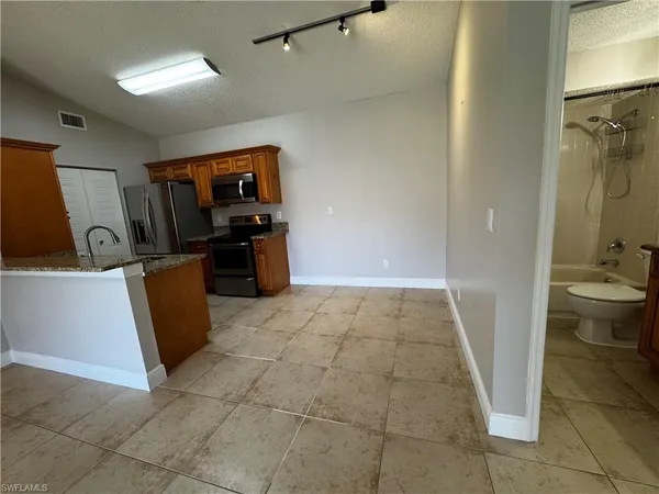 a view of a storage & utility room with two washing machine