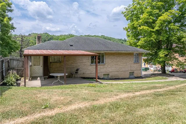 an aerial view of a house with outdoor space