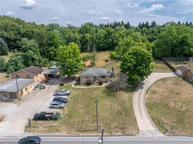 a house with swimming pool in front of it