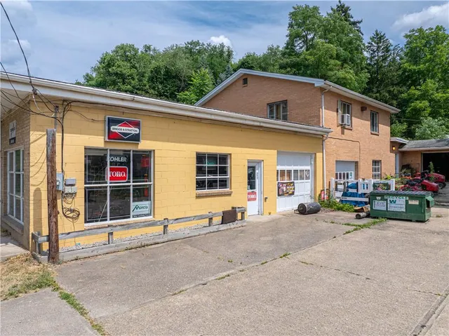 a front view of a house with garden and porch