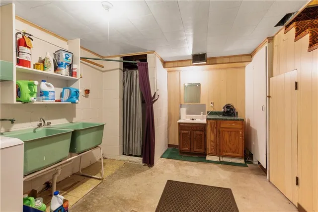 a room with painting and a table