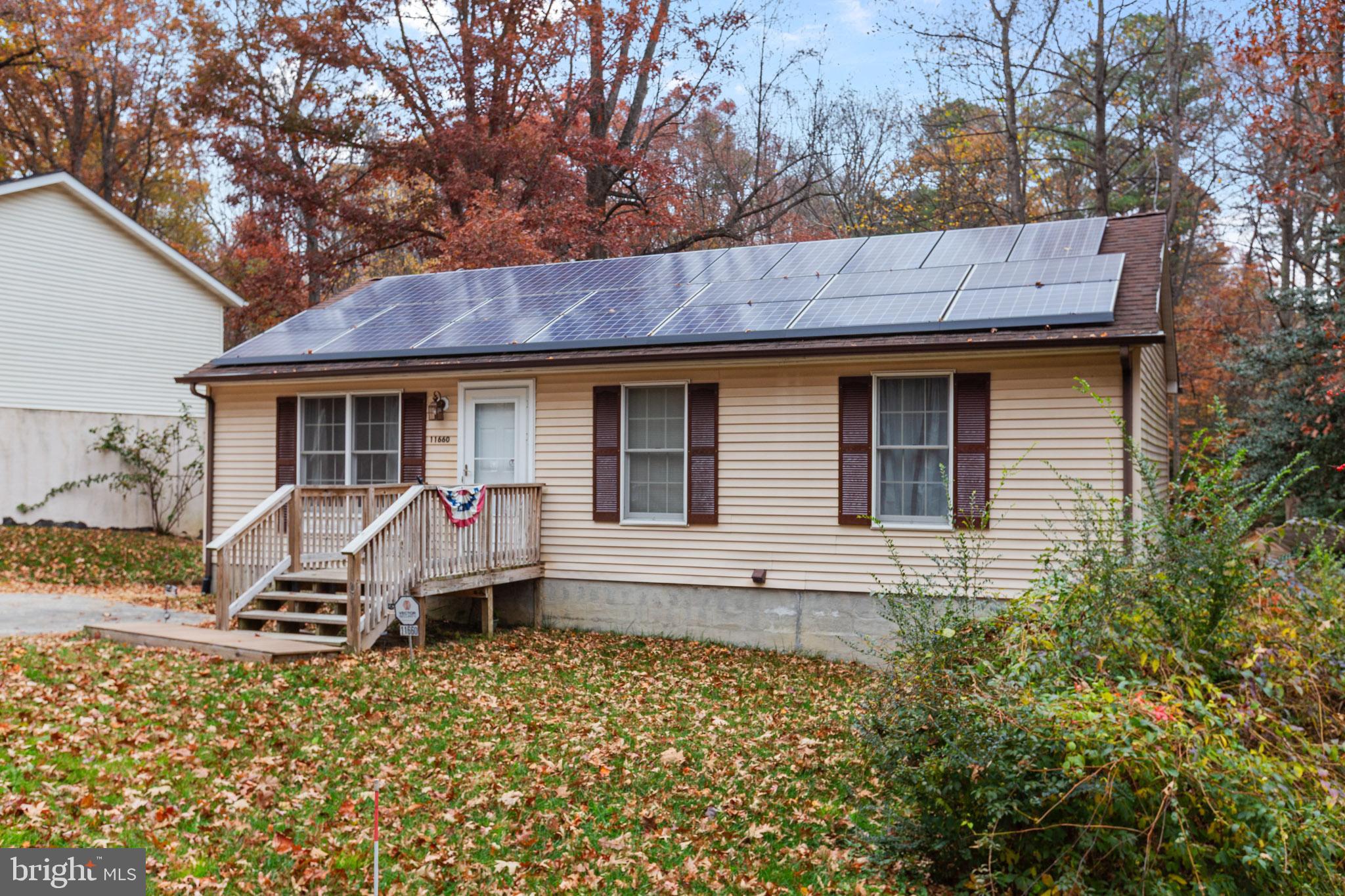 11660 Big Sandy Run Road Lusby, MD 20657 - Photo 2 of 30 a view of a house with wooden fence