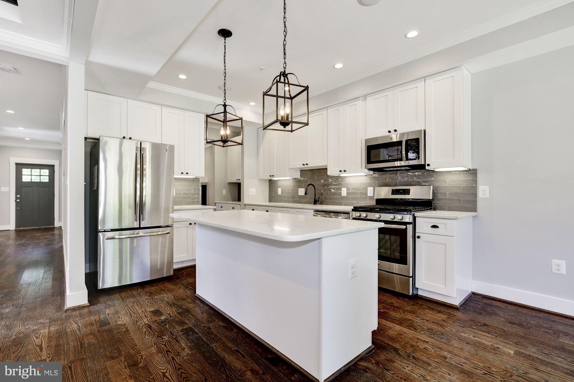 717 Thayer Avenue Silver Spring, MD 20910 - Photo 12 of 30 Island Kitchen open to living area