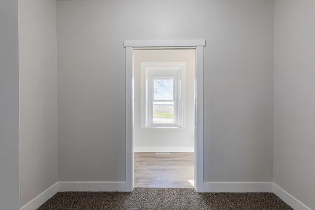 a view of a room that has a window in it