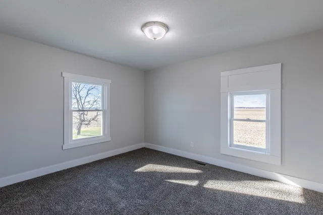 a view of a terrace with wooden floor and fence