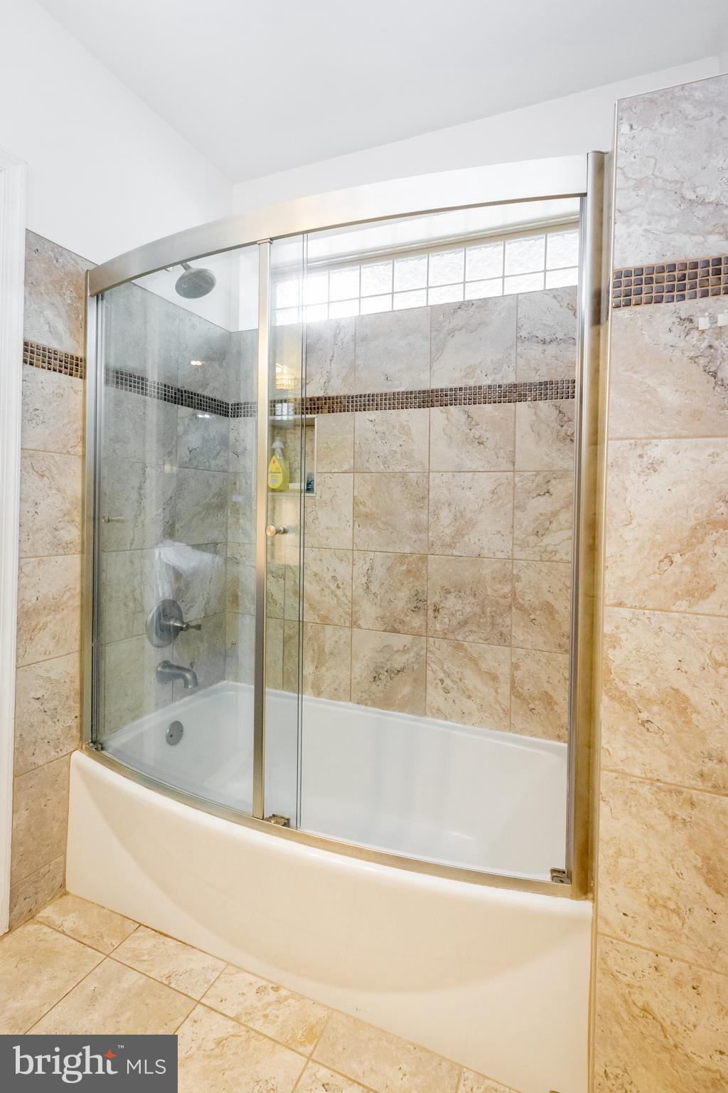 423 18th Street Northeast, Unit 12 Washington, DC 20002 - Photo 24 of 41 a bathroom with a bathtub and a shower