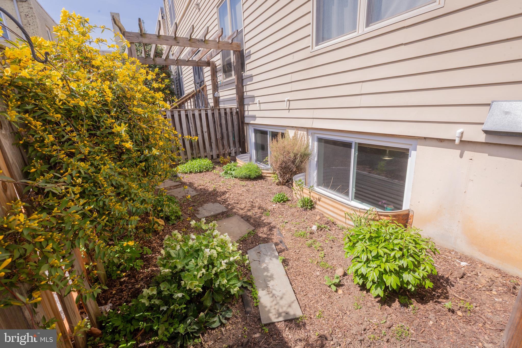 423 18th Street Northeast, Unit 12 Washington, DC 20002 - Photo 37 of 41 a house with a yard and a stove