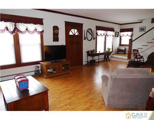 30 Friendship Road Cranbury, NJ 08512 - Photo 2 of 19 a living room with furniture and a flat screen tv