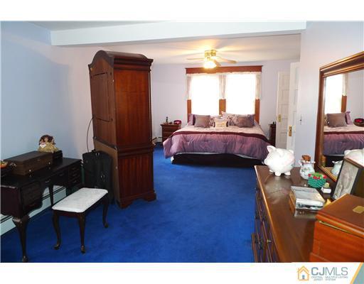 30 Friendship Road Cranbury, NJ 08512 - Photo 11 of 19 a living room with furniture and a window