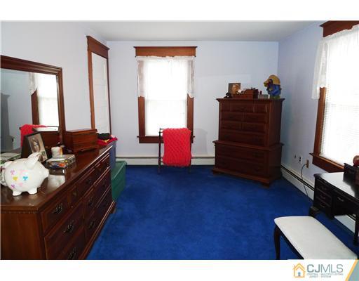 30 Friendship Road Cranbury, NJ 08512 - Photo 12 of 19 a living room with furniture and dresser with wooden floor