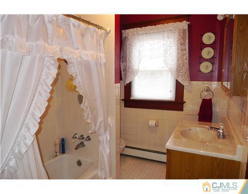 30 Friendship Road Cranbury, NJ 08512 - Photo 14 of 19 a bathroom with a sink and a mirror
