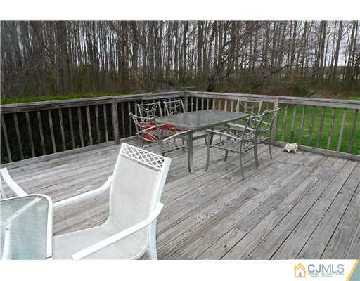 30 Friendship Road Cranbury, NJ 08512 - Photo 17 of 19 a view of balcony with wooden floor and yard