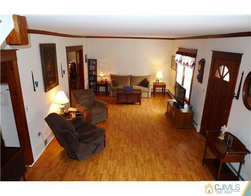 30 Friendship Road Cranbury, NJ 08512 - Photo 3 of 19 a living room with furniture and a flat screen tv