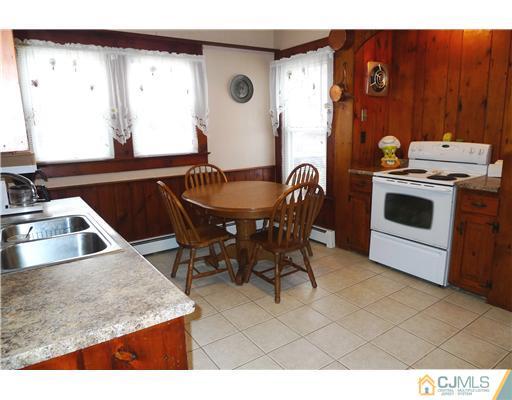 30 Friendship Road Cranbury, NJ 08512 - Photo 6 of 19 a kitchen with a sink a stove and a refrigerator