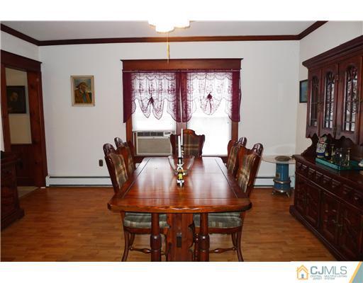 30 Friendship Road Cranbury, NJ 08512 - Photo 7 of 19 a view of a dining room with furniture and wooden floor