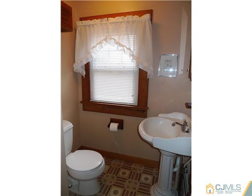 30 Friendship Road Cranbury, NJ 08512 - Photo 9 of 19 a bathroom with a toilet sink and mirror