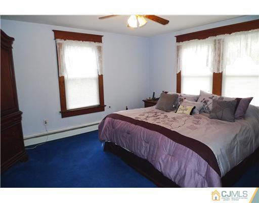 30 Friendship Road Cranbury, NJ 08512 - Photo 10 of 19 a bedroom with a bed and a window