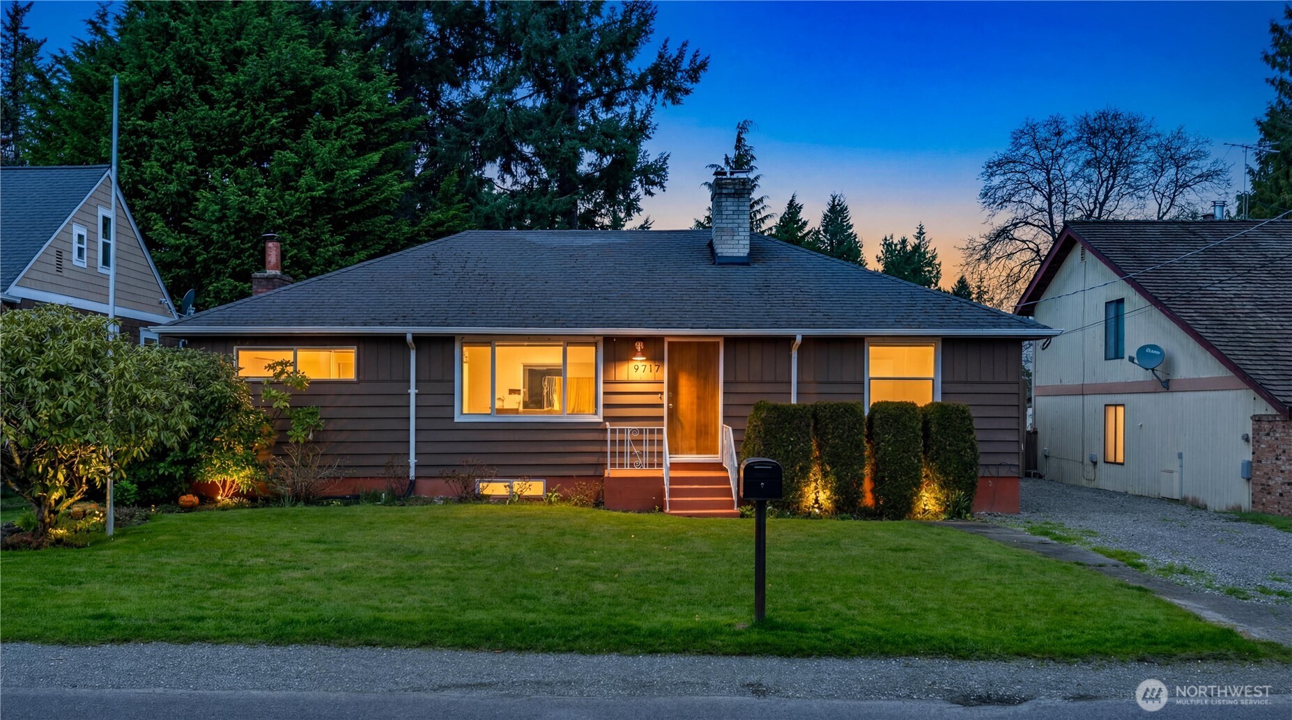 9717 14th Avenue Northwest Seattle, WA 98117 - Photo 1 of 32 a front view of a house with a yard