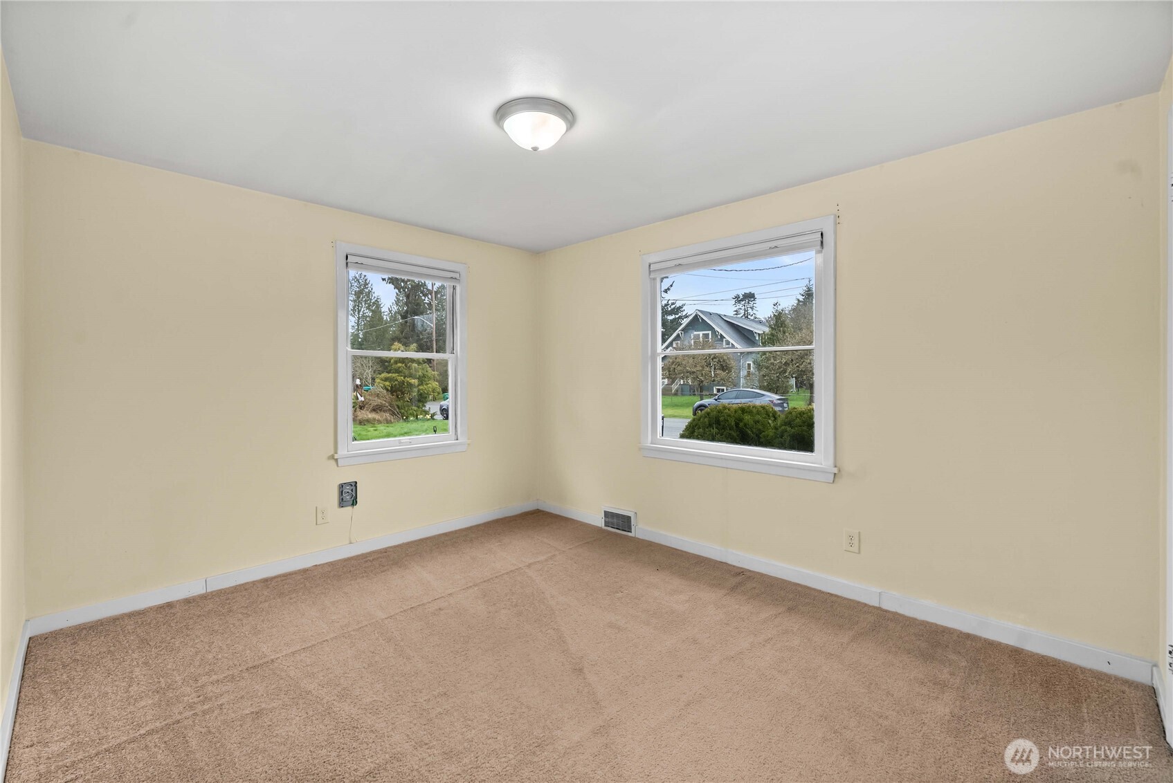 9717 14th Avenue Northwest Seattle, WA 98117 - Photo 14 of 32 an empty room with windows
