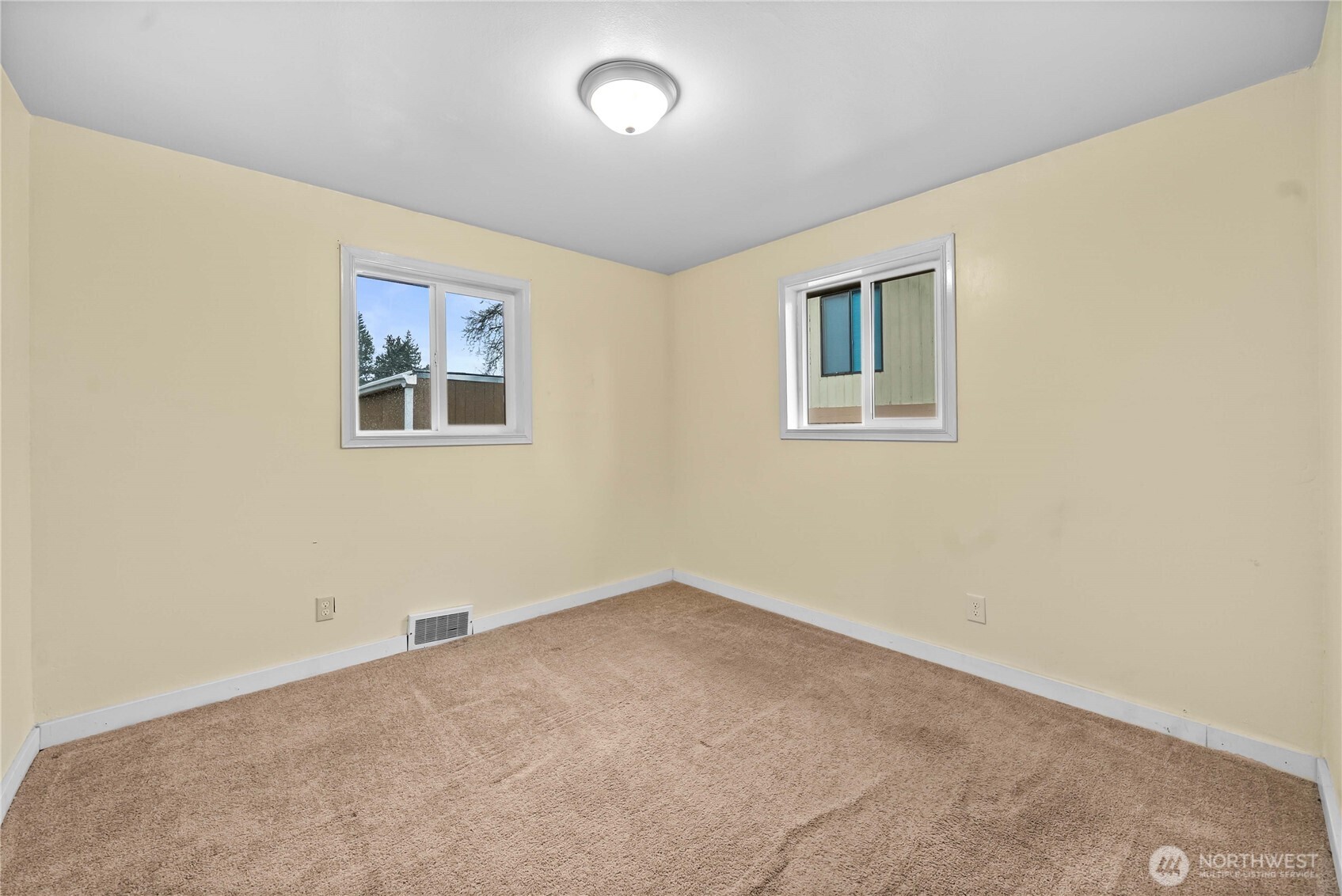 9717 14th Avenue Northwest Seattle, WA 98117 - Photo 15 of 32 an empty room with a window