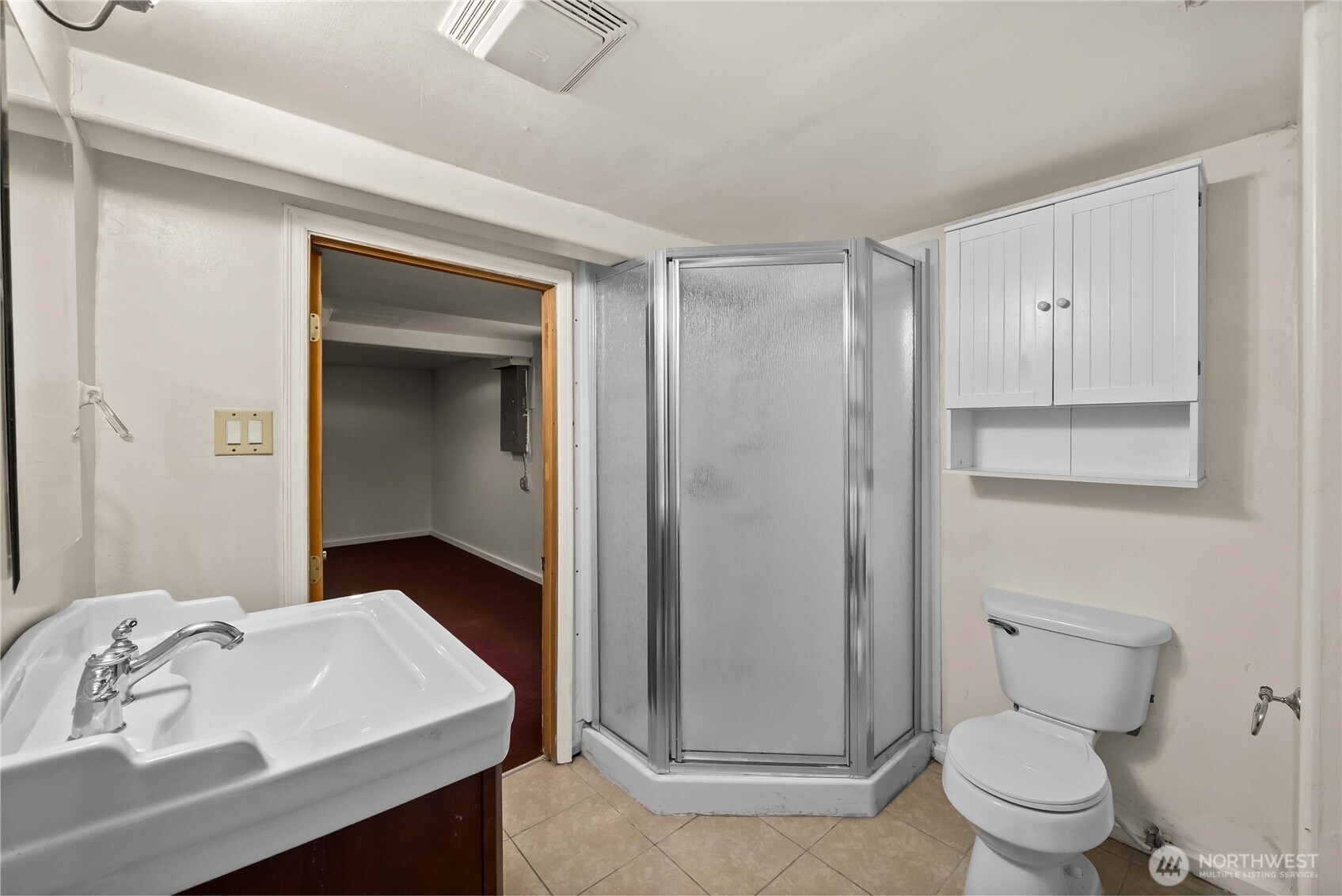 9717 14th Avenue Northwest Seattle, WA 98117 - Photo 18 of 32 a bathroom with a sink a toilet and shower
