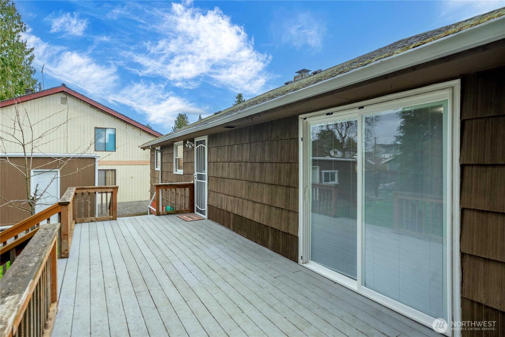 9717 14th Avenue Northwest Seattle, WA 98117 - Photo 23 of 32 a view of a house with a wooden deck