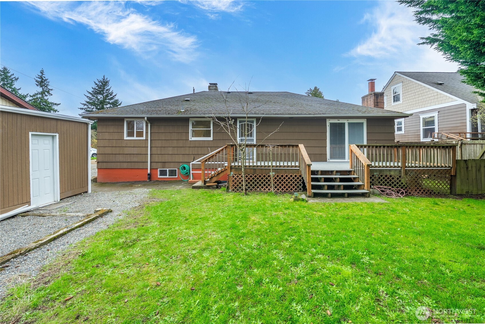 9717 14th Avenue Northwest Seattle, WA 98117 - Photo 25 of 32 a front view of a house with a yard