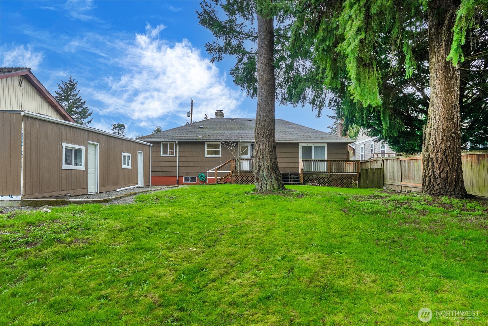 9717 14th Avenue Northwest Seattle, WA 98117 - Photo 28 of 32 a view of a house with a yard
