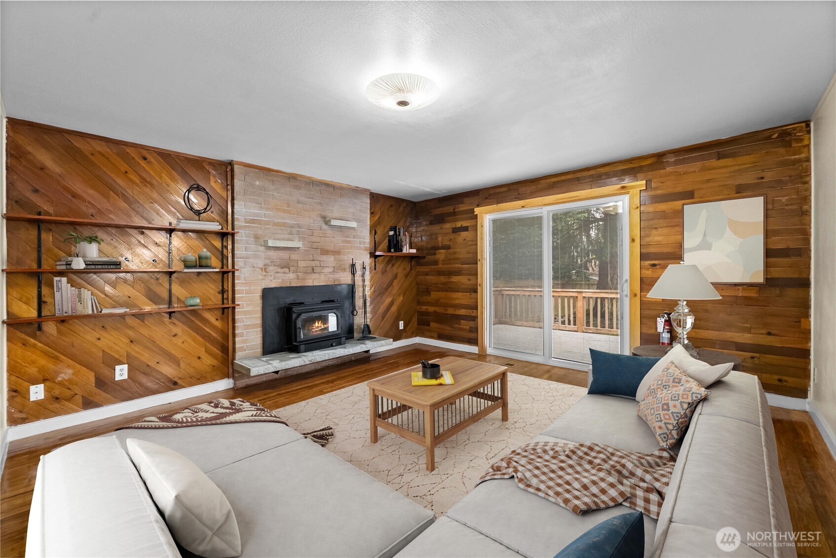 9717 14th Avenue Northwest Seattle, WA 98117 - Photo 9 of 32 a living room with furniture and a fireplace