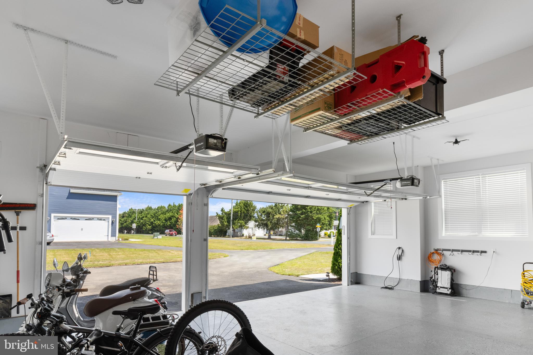 16672 New Road Lewes, DE 19958 - Photo 48 of 55 3 CAR GARAGE WITH CEILING STORAGE BINS & EV CHARGE