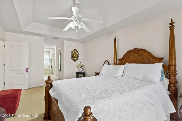 a view of a dining room with furniture and a floor to ceiling window