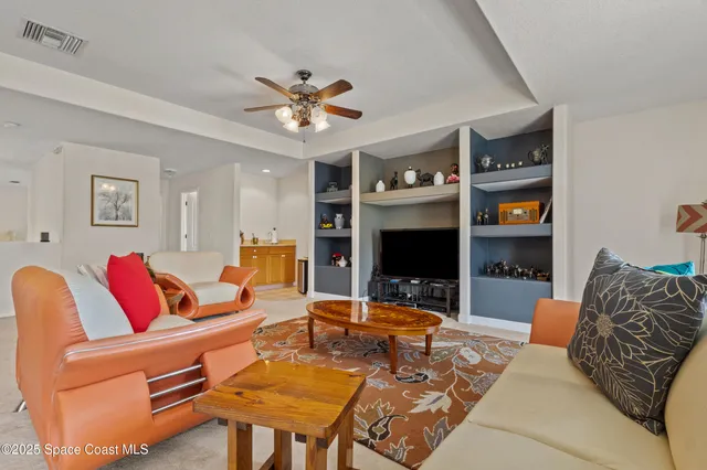 an aerial view of residential houses with outdoor space and swimming pool