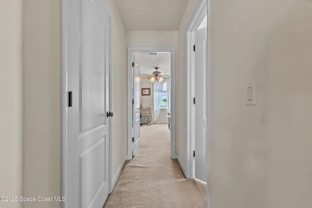an aerial view of residential houses with outdoor space and seating