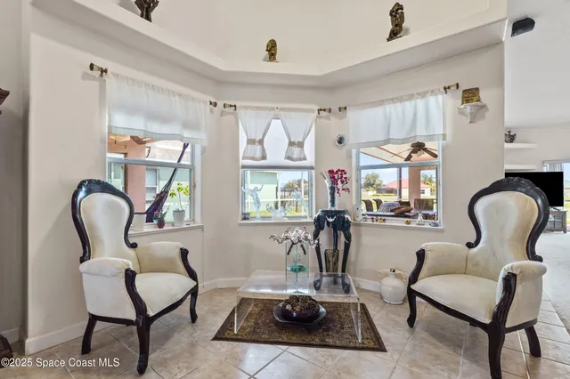 a kitchen with stainless steel appliances furniture a refrigerator and a stove top oven