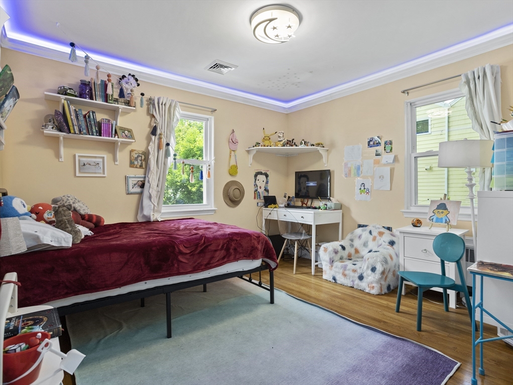 29 Payson Road Brookline, MA 02467 - Photo 11 of 28 a bed room with furniture and a window