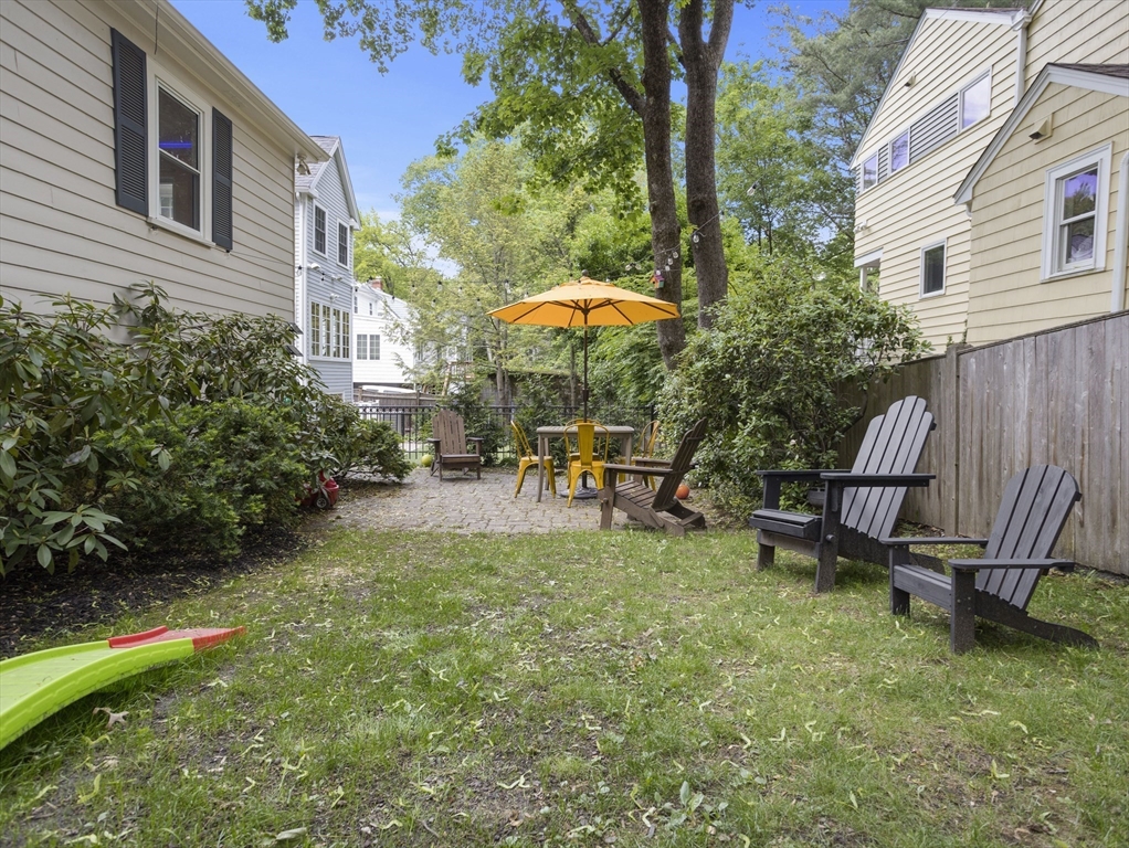 29 Payson Road Brookline, MA 02467 - Photo 19 of 28 a view of a backyard with sitting area and furniture