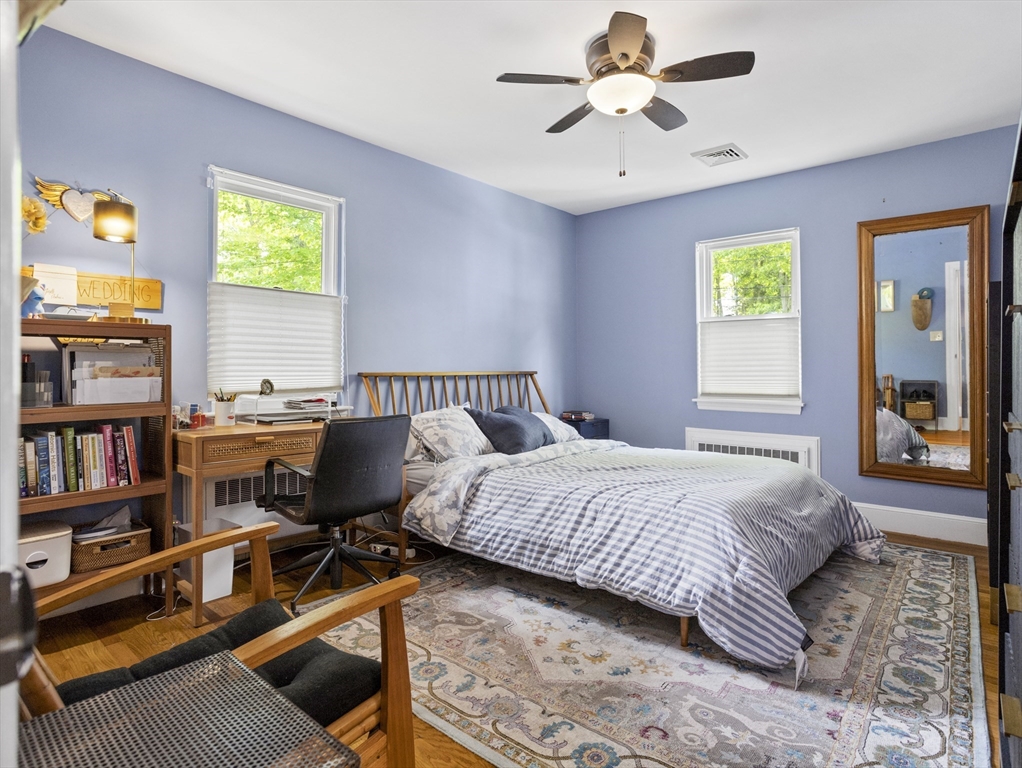 29 Payson Road Brookline, MA 02467 - Photo 10 of 28 a bedroom with a bed furniture and a book shelf