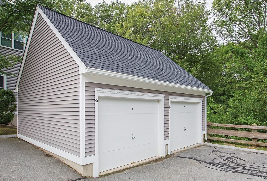 9 Maple Ridge Drive, Unit 9 Burlington, MA 01803 - Photo 11 of 11 a house with trees in front of it