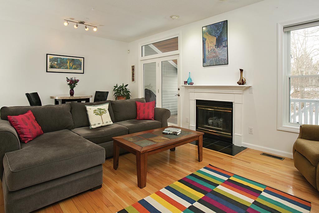 9 Maple Ridge Drive, Unit 9 Burlington, MA 01803 - Photo 2 of 11 a living room with furniture and a fireplace