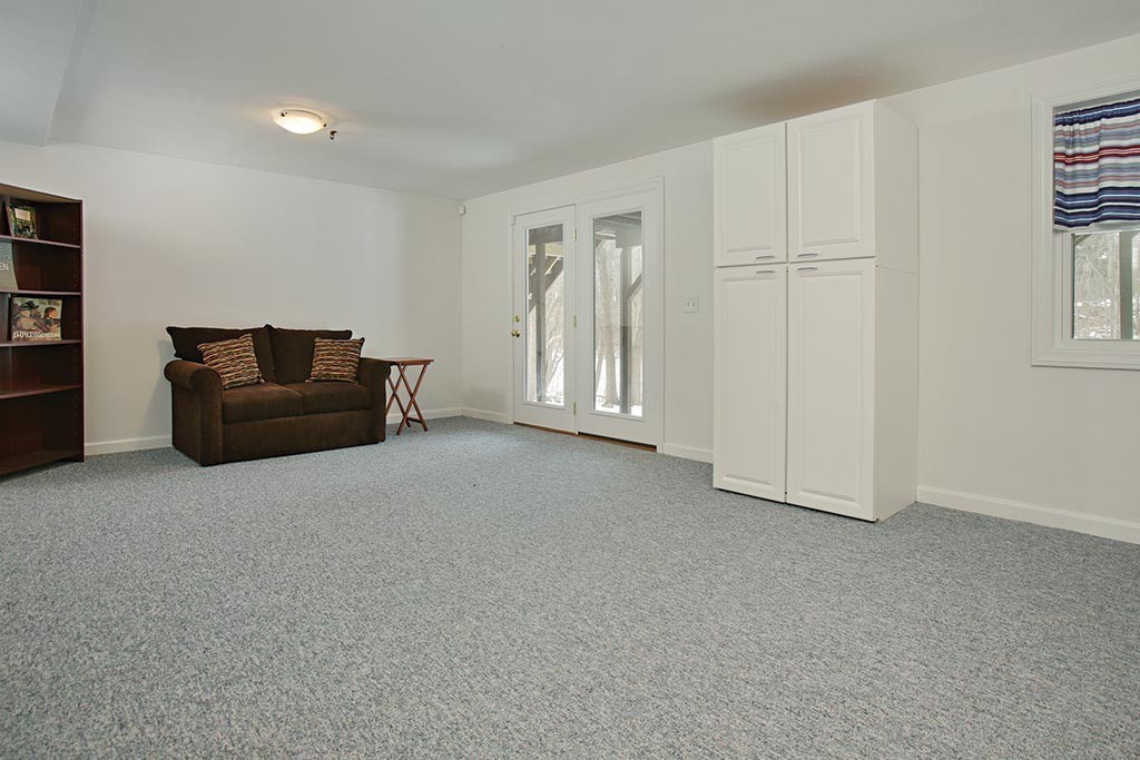 9 Maple Ridge Drive, Unit 9 Burlington, MA 01803 - Photo 6 of 11 a living room with furniture and a window