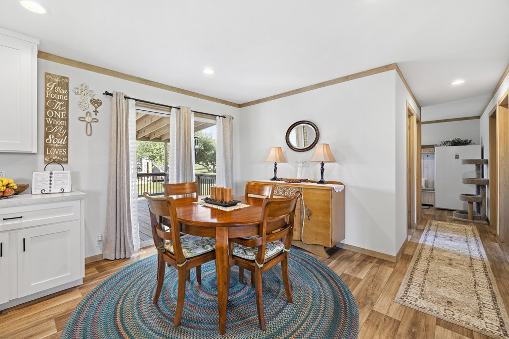 64 Scott Branch Road Harper, TX 78631 - Photo 11 of 36 a view of a dining room with furniture window and wooden floor