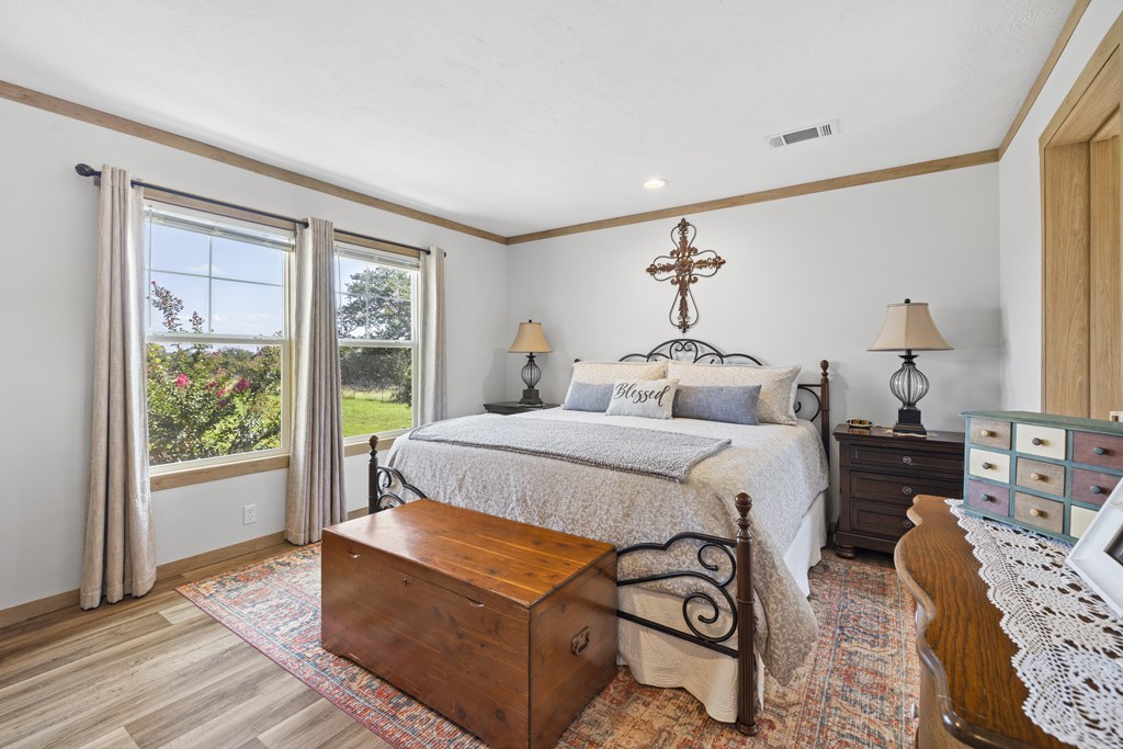 64 Scott Branch Road Harper, TX 78631 - Photo 12 of 36 a bedroom with furniture and wooden floor