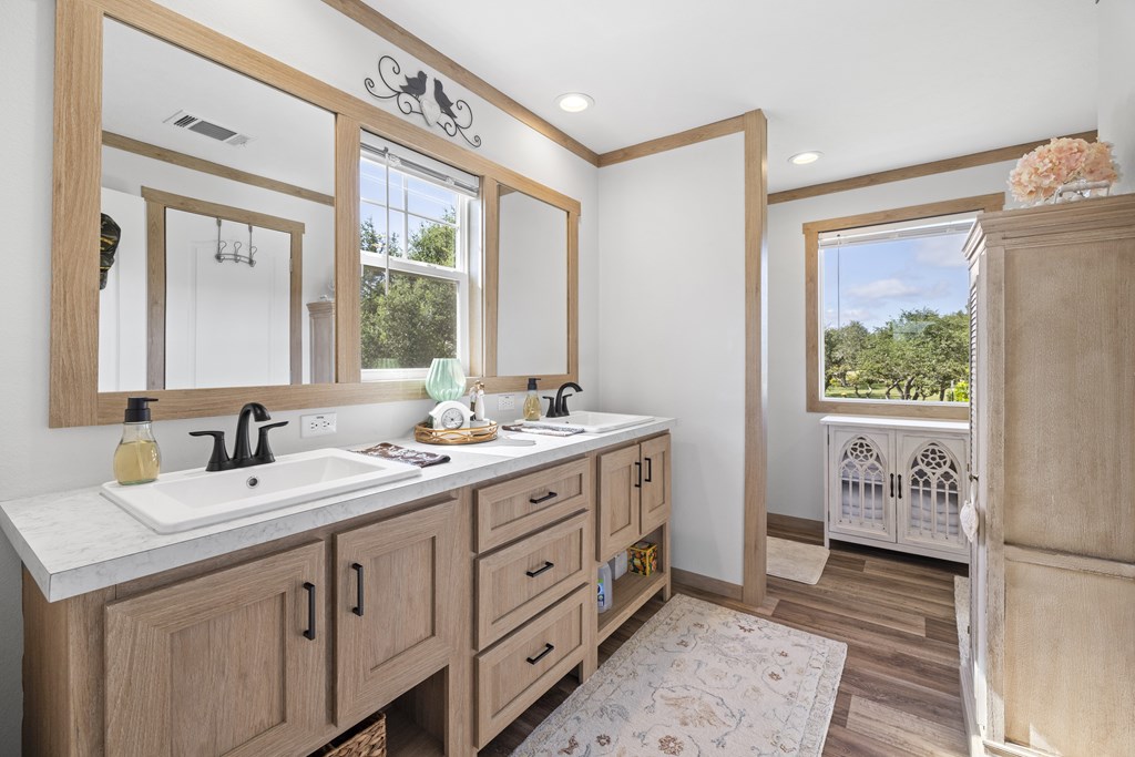 64 Scott Branch Road Harper, TX 78631 - Photo 13 of 36 a bathroom with a sink a mirror and a window