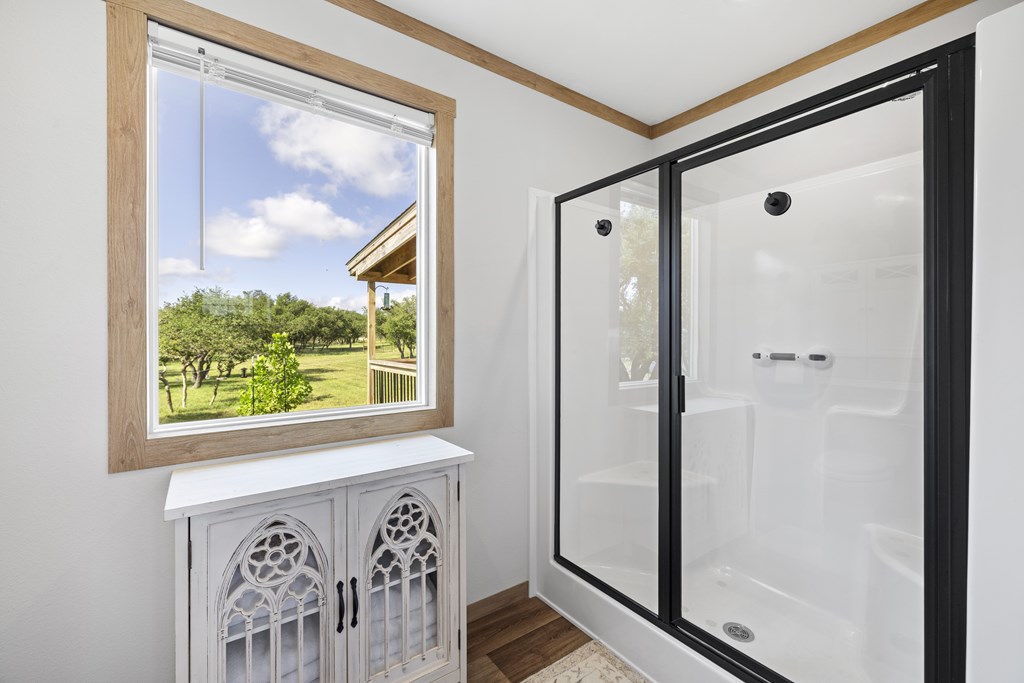 64 Scott Branch Road Harper, TX 78631 - Photo 15 of 36 a front view of a house with wooden floor and a painting on the wall