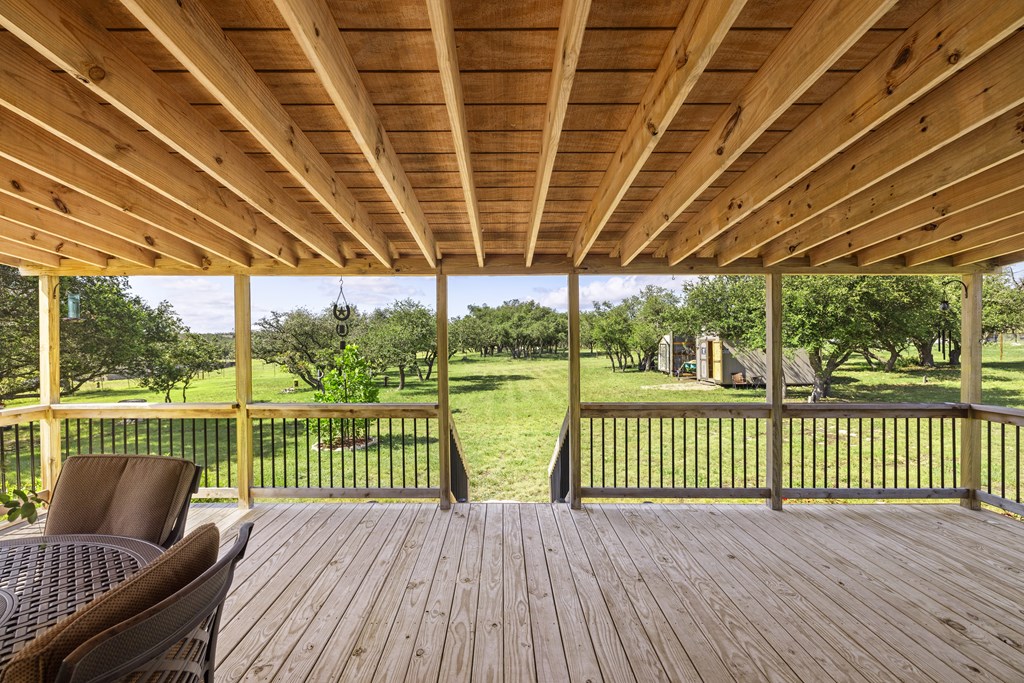 64 Scott Branch Road Harper, TX 78631 - Photo 20 of 36 a view of a deck with wooden floor next to a yard