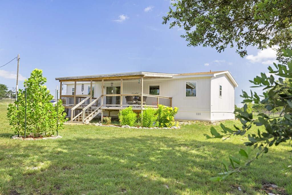 64 Scott Branch Road Harper, TX 78631 - Photo 22 of 36 a view of front of house with a yard