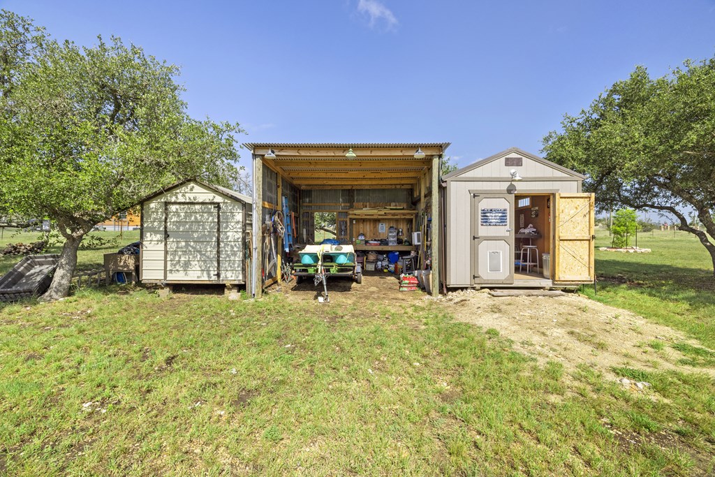64 Scott Branch Road Harper, TX 78631 - Photo 24 of 36 a front view of a house with garden
