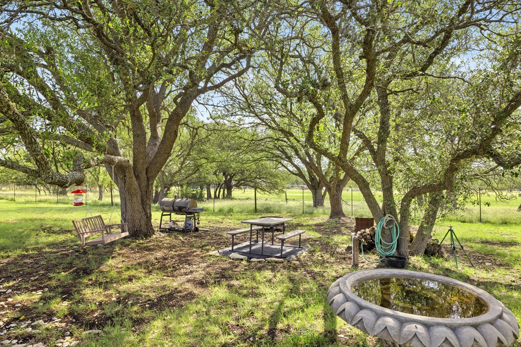 64 Scott Branch Road Harper, TX 78631 - Photo 26 of 36 a view of a swimming pool with a patio