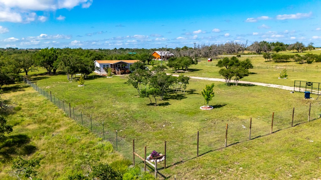 64 Scott Branch Road Harper, TX 78631 - Photo 32 of 36 a view of a swimming pool with an outdoor seating