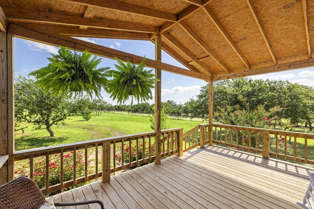 64 Scott Branch Road Harper, TX 78631 - Photo 7 of 36 a view of balcony with wooden floor